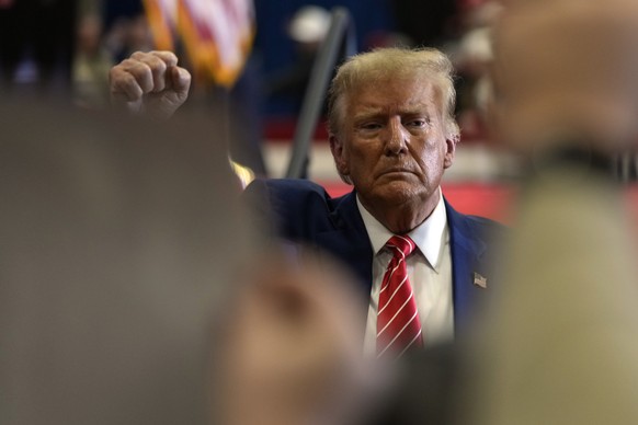 Republican presidential candidate former President Donald Trump gestures after speaking during a commit to caucus rally, Saturday, Jan. 6, 2024, in Clinton, Iowa. (AP Photo/Charlie Neibergall)
Donald  ...