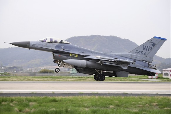 In this photo provided on Sunday, April 16, 2023 by South Korea Defense Ministry, U.S. F-16 fighter jets makes a landing at the Gwangju Air Base in South Korea, Friday, April 14. The South Korean and  ...