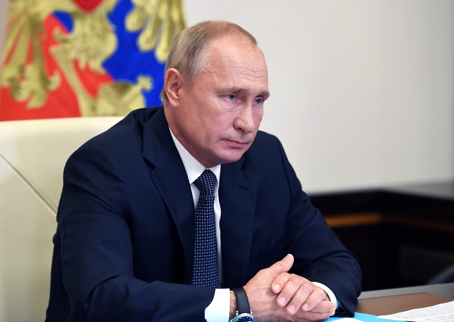 Russian President Vladimir Putin attends a cabinet meeting at the Novo-Ogaryovo residence outside Moscow, Russia, Tuesday, Aug. 11, 2020. Putin says that a coronavirus vaccine developed in the country ...