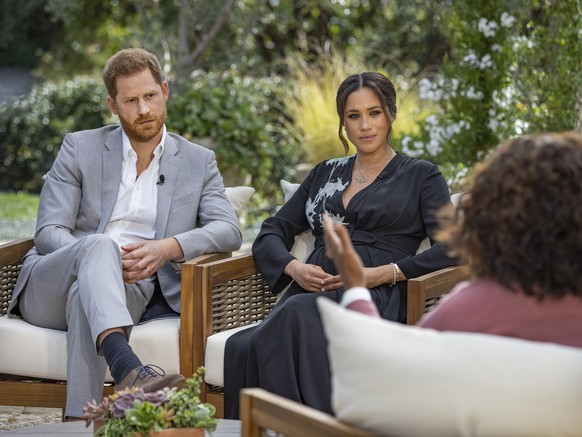 FILE - This image provided by Harpo Productions shows Prince Harry, from left, and Meghan, Duchess of Sussex, in conversation with Oprah Winfrey. Almost as soon as the interview aired, many were quick ...