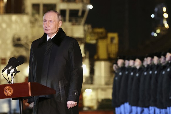 Russian President Vladimir Putin attends a ceremonial ship launching for the nuclear-powered submarine Perm at the Atomflot, a service base for nuclear-powered fleet, in Murmansk, Russia, Thursday, Ma ...