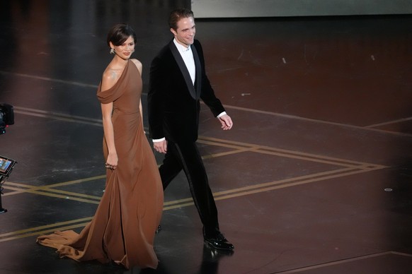 Zendaya, left, and Robert Pattinson present the award for best directing during the Oscars on Sunday, March 15, 2026, at the Dolby Theatre in Los Angeles. (AP Photo/Chris Pizzello)
Zendaya,Robert Patt ...