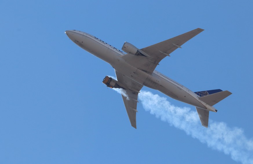 epa09028737 A photo provided by Instagram user Hayden Smith (speedbird5280) shows United Airlines flight 328 (Boeing 777-200, tailnumber N772UA) with an engine on fire, near Denver, Colorado, USA, 20 ...