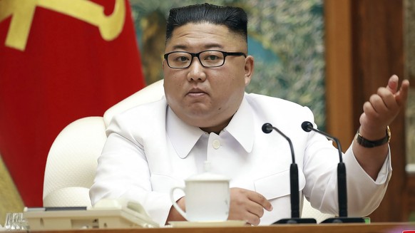 In this photo provided by the North Korean government, North Korean leader Kim Jong Un attends an emergency Politburo meeting in Pyongyang, North Korea Saturday, July 25, 2020. Independent journalists ...