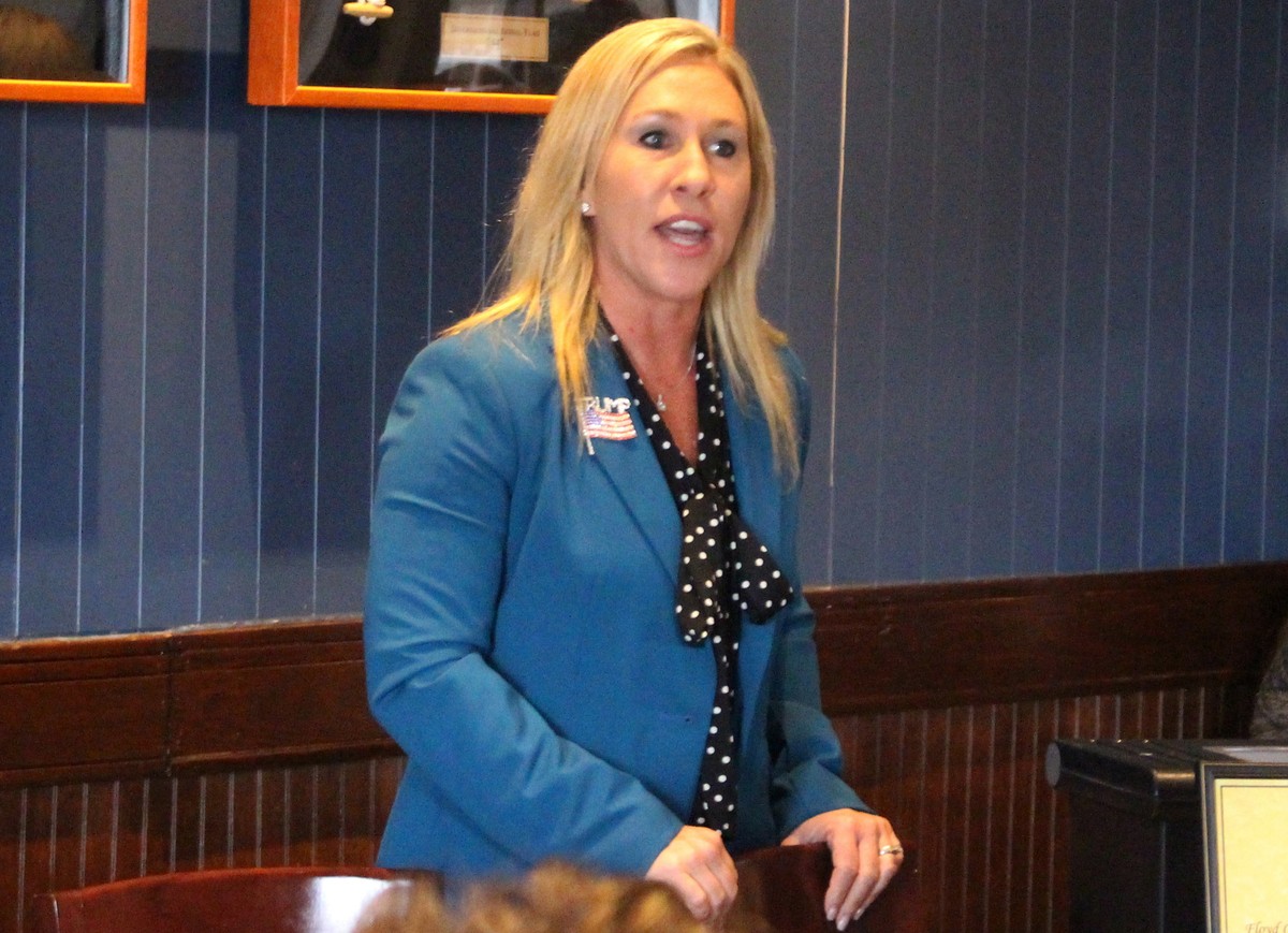 FILE - In this March 3, 2020, file photo, Republican Marjorie Taylor Greene speaks to a GOP women's group in Rome, Ga. Greene, criticized for promoting racist videos and adamantly supporting the  ...