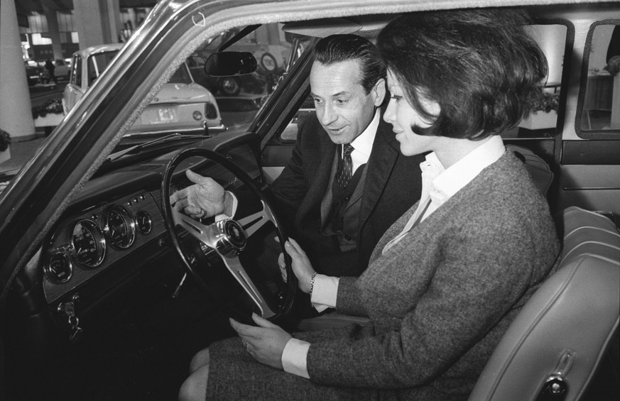 Photographer: Vogt, Jules Title: Geneva Motor Show, Hino Contessa 1300 Description: Visitors sitting in car Date: 1965 Included in: Geneva Motor Show, 1965.