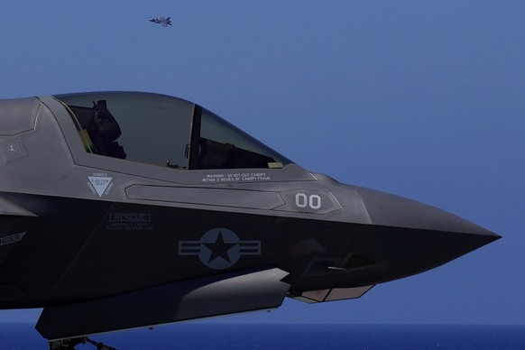 F-35 aircraft fly over the U.K.&#039;s aircraft carrier HMS Queen Elizabeth in the Mediterranean Sea on Sunday, June 20, 2021. The British Royal Navy commanders say the U.K.&#039;s newest aircraft car ...