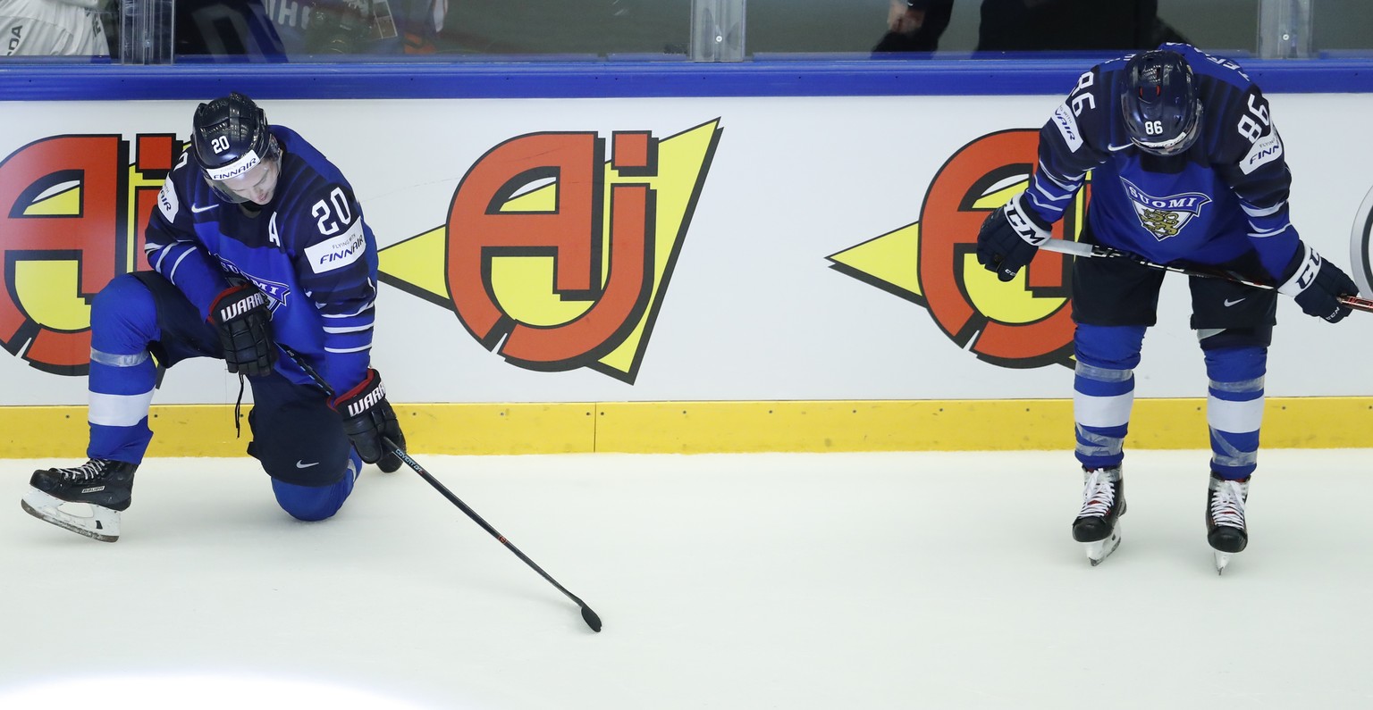 Finland&#039;s Sebastian Aho, left, and Finland&#039;s Teuvo Teravainen, right, react fter the Ice Hockey World Championships quarterfinal match between Finland and Switzerland at the Jyske Bank Boxen ...