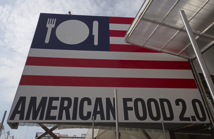 In this picture taken on May 2, 2015 and made available on Wednesday, May 27, 2015, a visitor leans out of the roof of the United States pavilion at the 2015 Expo in Rho, near Milan, Italy. At the Exp ...