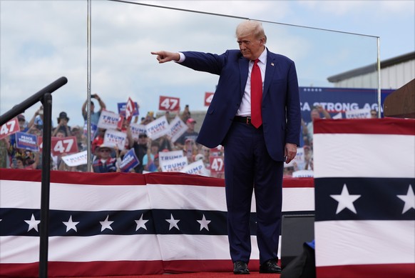 Republican presidential nominee former President Donald Trump points during a campaign rally at North Carolina Aviation Museum, Wednesday, Aug. 21, 2024, in Asheboro, N.C. (AP Photo/Julia Nikhinson)