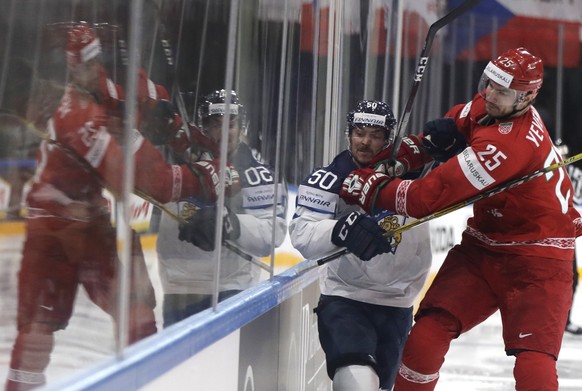 Belarus&#039; Oleg Yevenko, right, challenges Finland&#039;s Juhamatti Aaltonen, left, during the Ice Hockey World Championships group B match between Finland and Belarus in the AccorHotels Arena in P ...