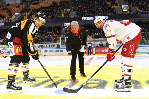 Switzerland&#039;s national soccer team trainer Vladimir Petkovic, center, makes a symbolic face-off with Lausanne&#039;s player Etienne Froidevaux, right, and Lugano&#039;s player Alessandro Chiesa,  ...