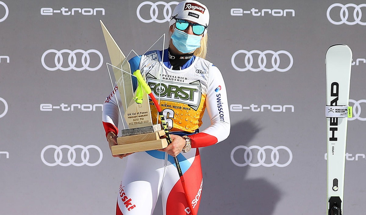 epa09038059 (L-R) Second placed Ramona Siebenhofer of Austria, Winner Lara Gut-Behrami of Switzerland and Third placed Corinne Suter of Switzerland celebrate on the podium after the Women's Downh ...