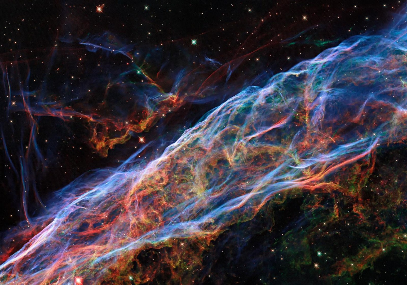 This Picture of the Week revisits the Veil Nebula, a popular subject for Hubble images! This object was featured in a previous Hubble photo release, but now new processing techniques have been applied ...