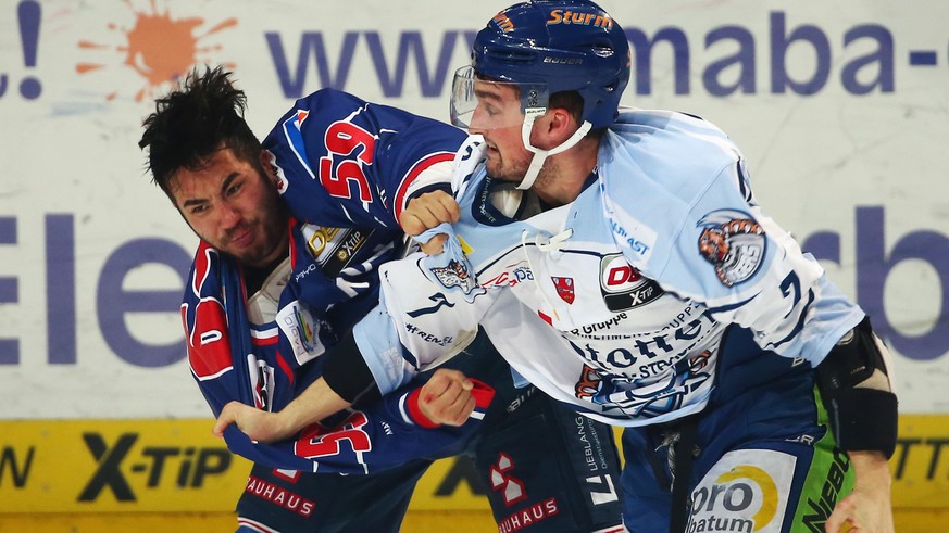 MANNHEIM, GERMANY - JANUARY 26: Brandon Yip (L) of Mannheim fights with Colton Jobke of Straubing during the DEL match between Adler Mannheim and Straubing Tigers at SAP Arena on January 26, 2016 in M ...