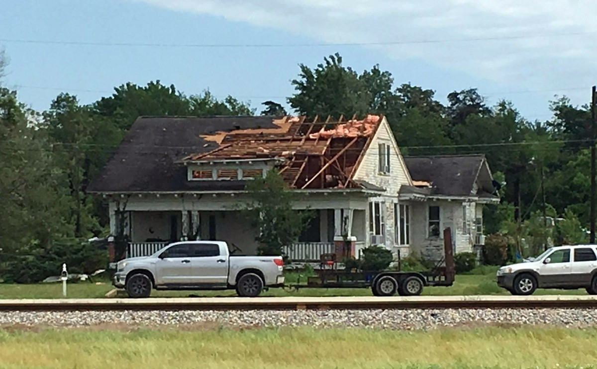 A roof is torn off a home following a suspected tornado, Saturday, April 13, 2019 in Franklin, Texas. (Laura McKenzie/College Station Eagle via AP)