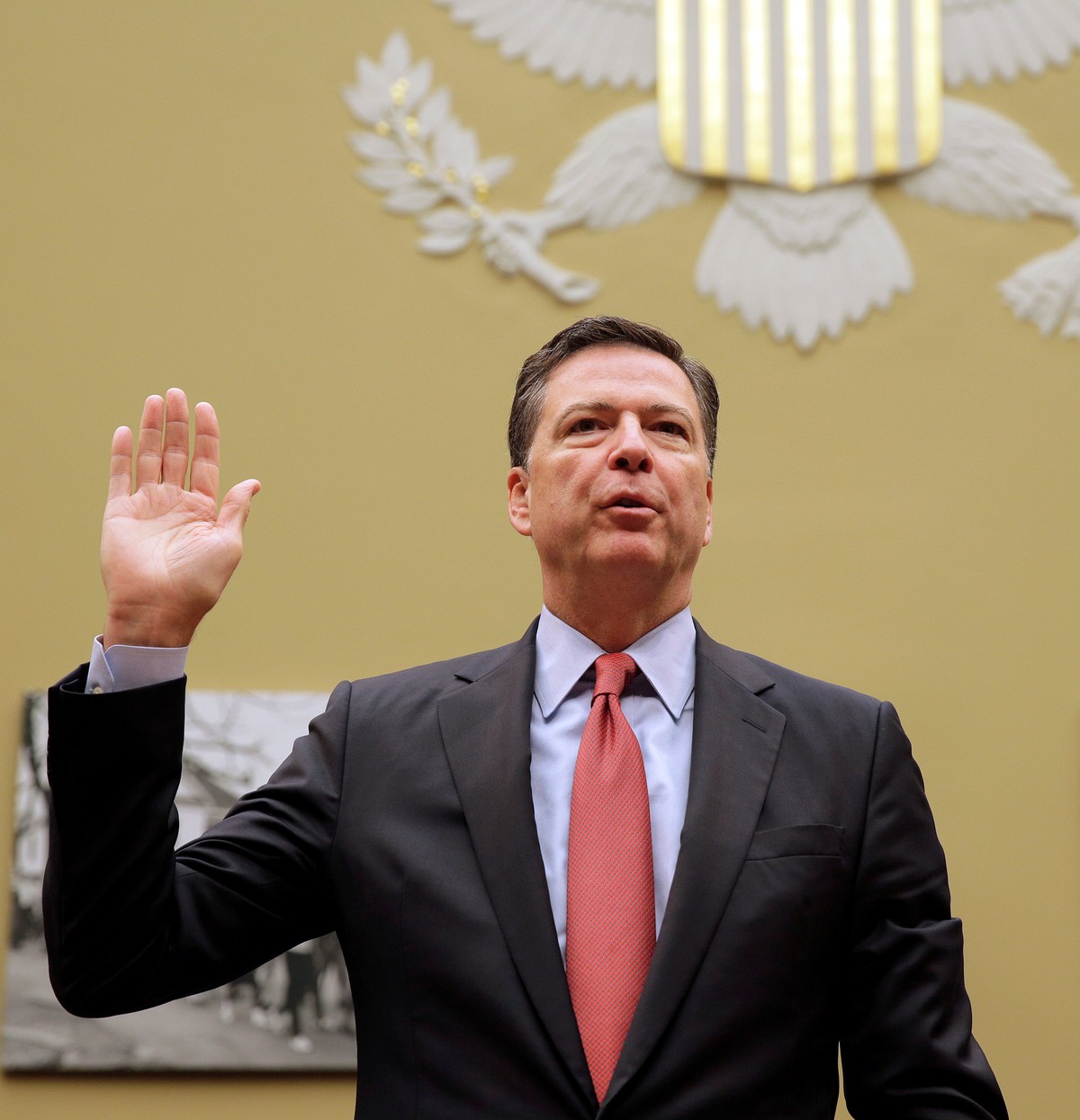 FBI Director James Comey is sworn in before testifying before a House Judiciary Committee hearing on "Oversight of the Federal Bureau of Investigation" on Capitol Hill in Washington, U.S., S ...