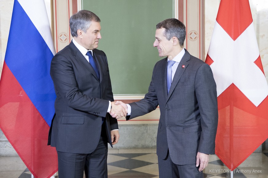 The Swiss Federal Councillor Ignazio Cassis, right, and the Russian State Duma Speaker Vyacheslav Volodin, left, shake hands during a official visit at the Swiss Parliament West, in Bern, Switzerland, ...