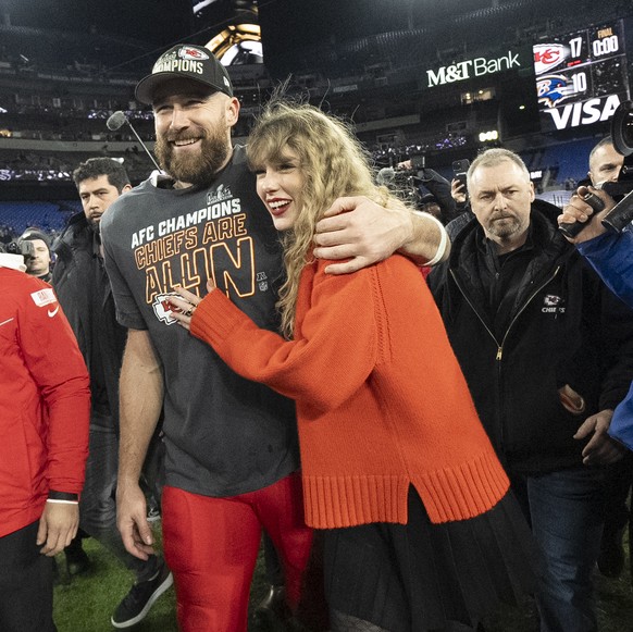 FILE - Kansas City Chiefs tight end Travis Kelce and Taylor Swift walk together after an AFC Championship NFL football game between the Chiefs and the Baltimore Ravens, Jan. 28, 2024, in Baltimore. Fo ...