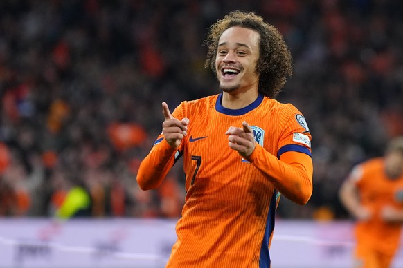 Netherlands' Xavi Simons celebrates scoring his side's 3rd goal during a World Cup 2026 group G qualifying soccer match between Netherlands and Lithuania in Amsterdam, Netherlands, Monday, N ...