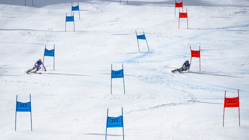 Wendy Holdener of Switzerland, left, in action against Paula Moltzan of the United States, right, during the 1/4 final of the women&#039;s Parallel race at the 2021 FIS Alpine Skiing World Championshi ...