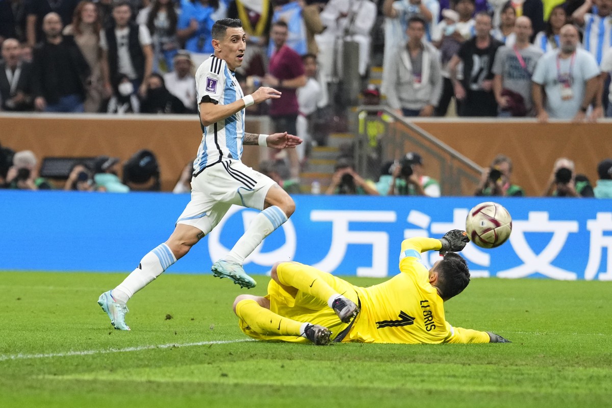 Argentina's Angel Di Maria scores his side's second goal past France's goalkeeper Hugo Lloris during the World Cup final soccer match between Argentina and France at the Lusail Stadium  ...