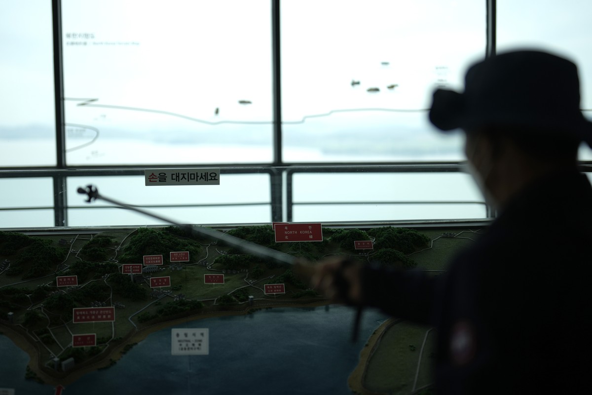 A visitor looks at the North Korean side from the unification observatory in Paju, South Korea, Thursday, May 30, 2024. North Korea on Thursday fired a barrage of suspected ballistic missiles toward i ...