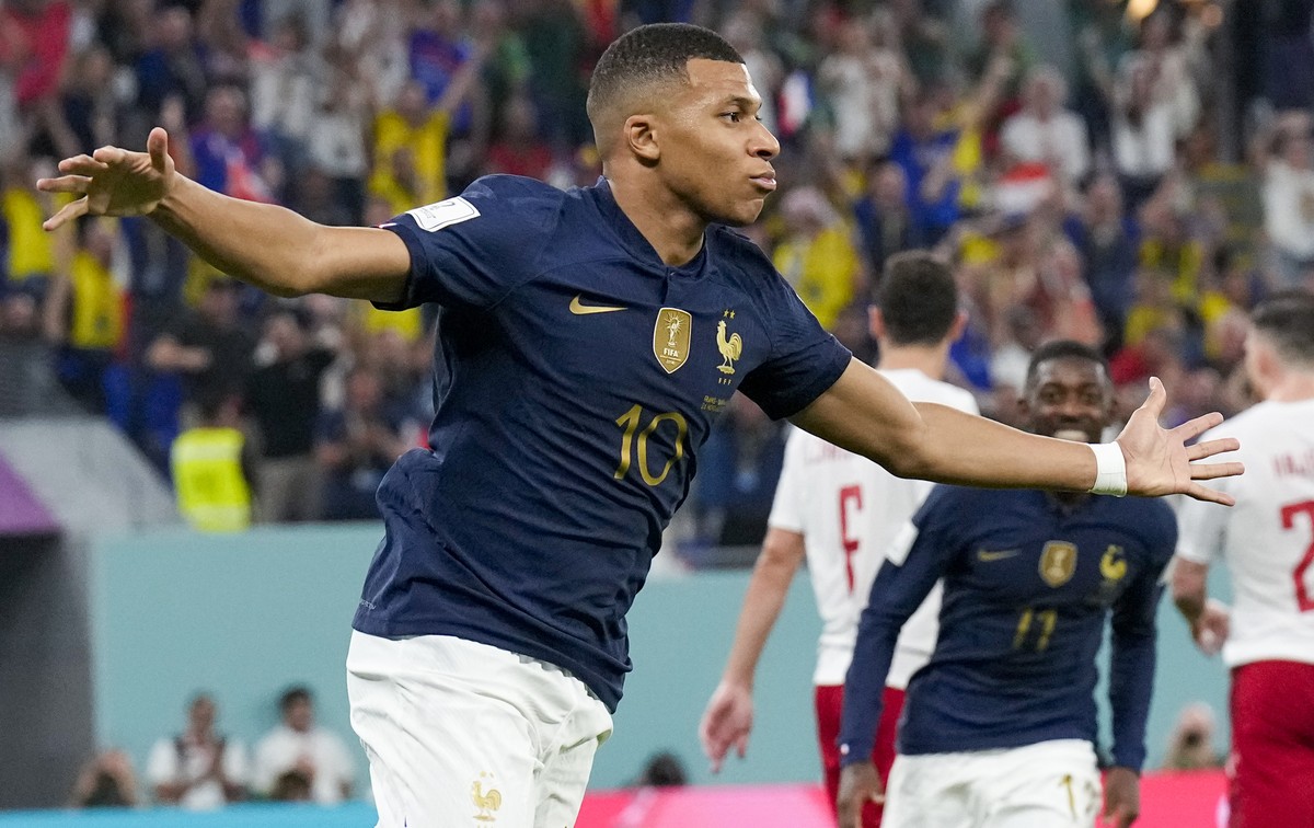 France's Kylian Mbappe celebrates scoring his side's opening goal against Denmark during a World Cup group D soccer match at the Stadium 974 in Doha, Qatar, Saturday, Nov. 26, 2022. (AP Phot ...