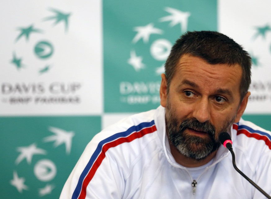 Serbian Davis Cup team captain Bogdan Obradovic speaks during a press conference in Novi Sad, Serbia, Thursday, Jan. 30, 2014. Serbia will play against Switzerland in the Davis Cup World Group play-of ...