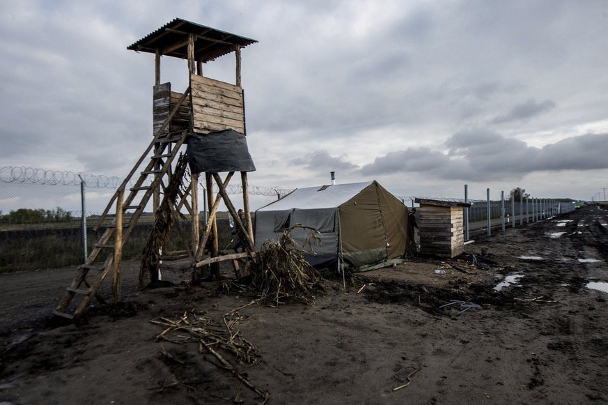 This photo taken Wednesday, Oct. 26, 2016, shows a lookout tower by an experimental section of the second line of the border fence during construction works at the Hungarian-Serbian border near the vi ...