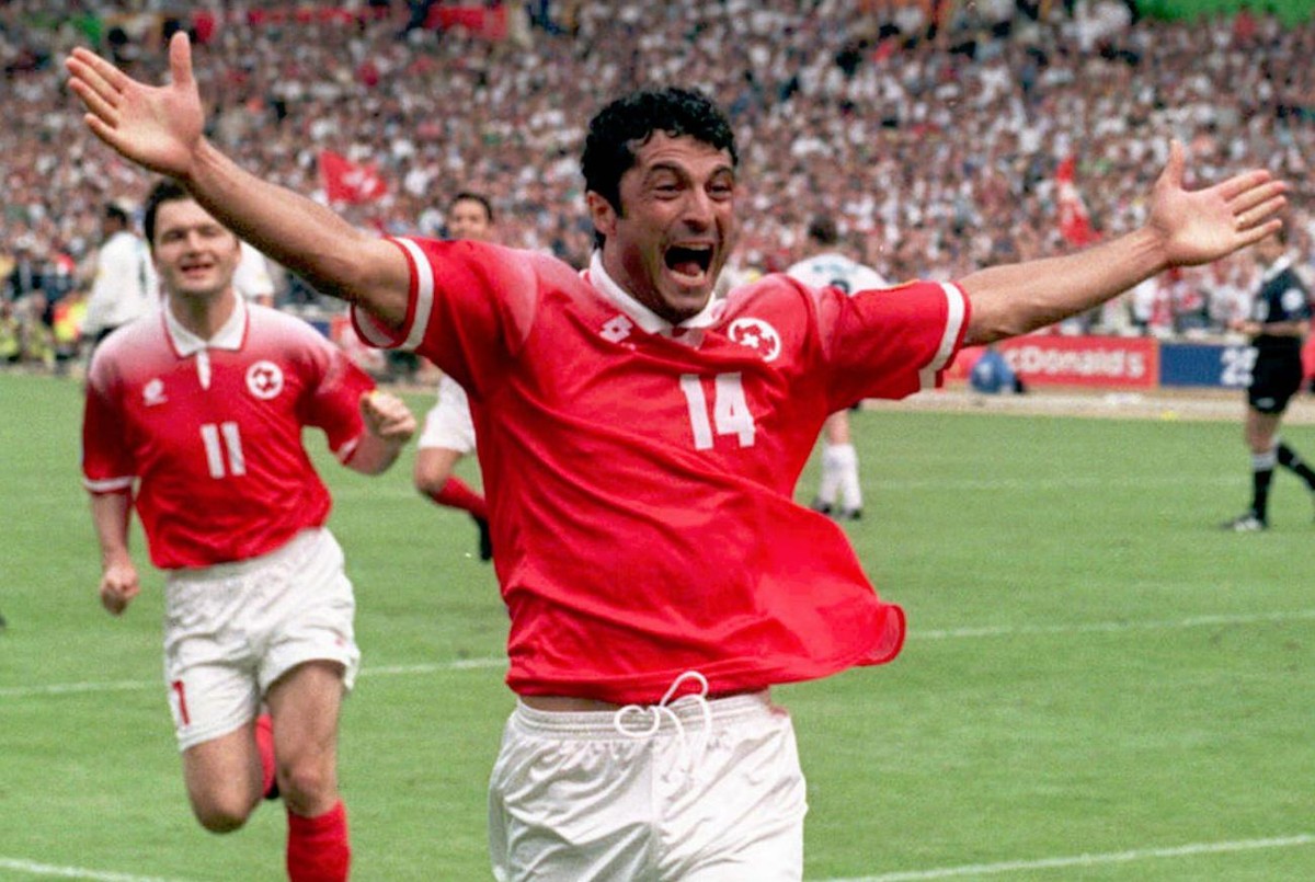 Switzerland's Kubilay Tuerkyilmaz celebrates after scoring from a penalty to equalize in the final minutes of the Saturday, June 8, 1996, opening Euro 96 Championship match against England, at We ...