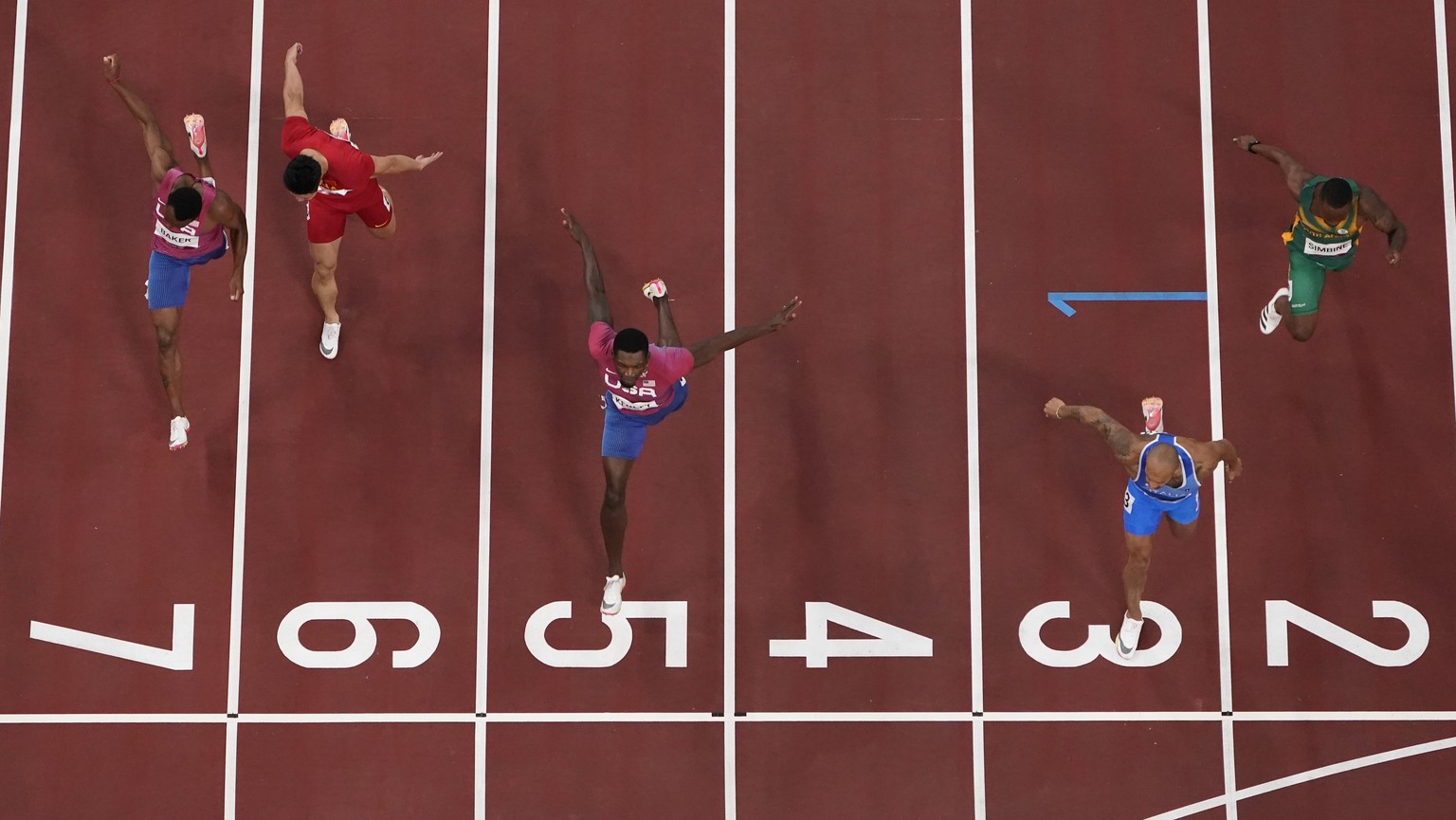 Lamont Jacobs, of Italy, beats Fred Kerley, of United States, during the finals in the men&#039;s 100-meter at the 2020 Summer Olympics, Sunday, Aug. 1, 2021, in Tokyo. (AP Photo/Morry Gash)