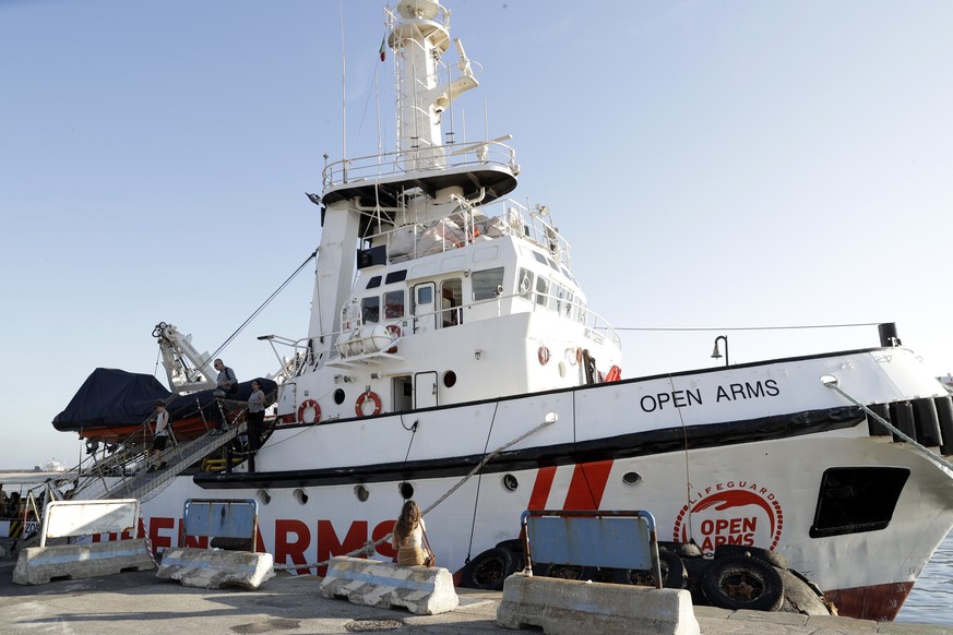 The Open Arms ship is moored at the Naples harbor, Italy, Thursday, June 20,2 019. The Spanish NGO migrant ship Open Arms is in Naples with activists speaking to media and the public to mark World Ref ...