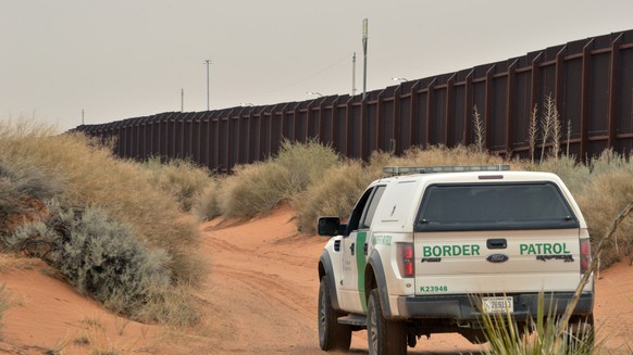 FILE - In this Jan. 4, 2016 photo, a U.S. Border Patrol agent drives near the U.S.-Mexico border fence in Santa Teresa, N.M. Can Donald Trump really make good on his promise to build a wall along the  ...
