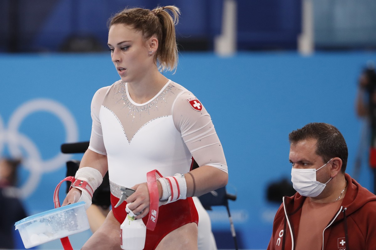 Giulia Steingruber of Switzerland and coach Fabien Martin before the performance at the uneven bars during the Artistic Gymnastics women's All-Around Final at the 2020 Tokyo Summer Olympics in To ...