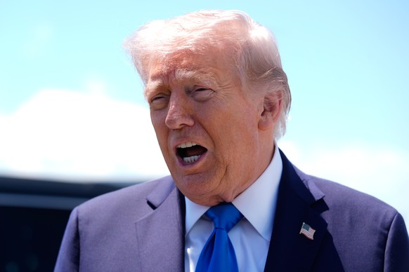 President Donald Trump speaks to reporters before boarding Air Force One at Palm Beach International Airport in West Palm Beach Fla., Saturday, April 25, 2026. (AP Photo/Manuel Balce Ceneta)
Donald Tr ...