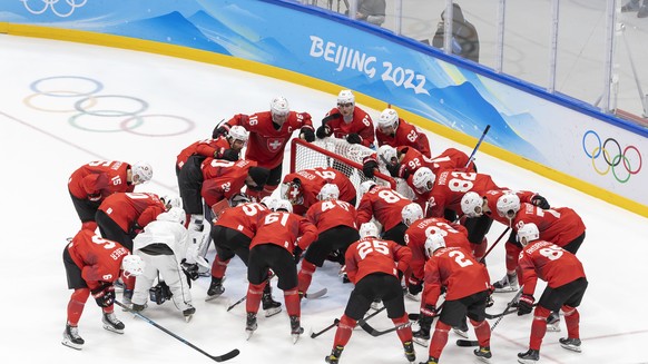 Switzerland&#039;s players huddle, prior the men&#039;s ice hockey qualification play-off game between the Czech Republic and Switzerland at the National Indoor Stadium at the 2022 Winter Olympics in  ...