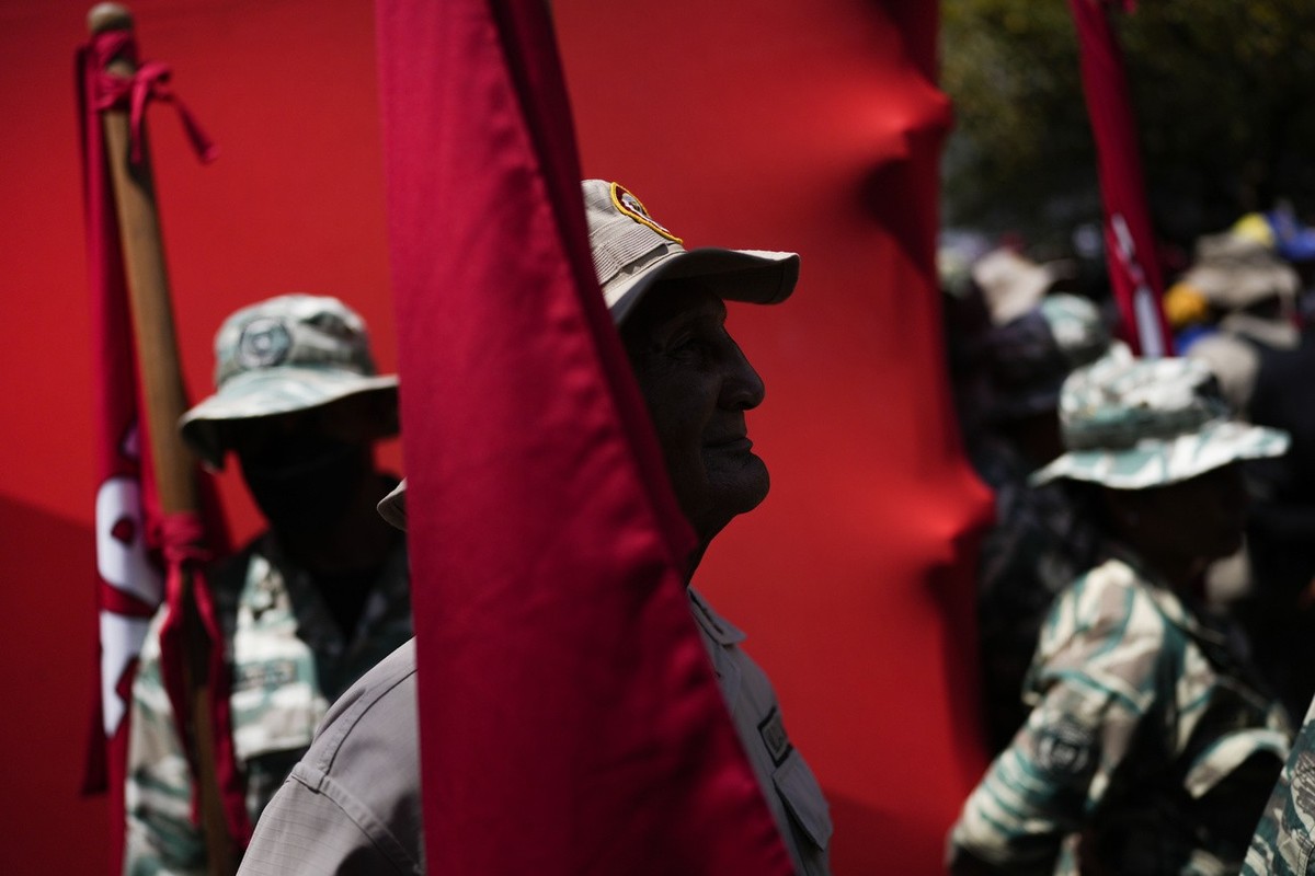 Bolivarian Militia members take part in a rally against corruption, in Caracas, Venezuela, Saturday, March 25, 2023. Venezuela's oil czar, Tareck El Aissami, who announced his resignation on Twit ...