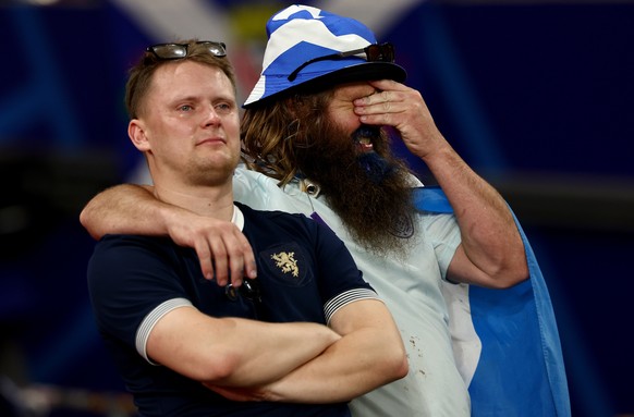 epaselect epa11433344 Dejected fans of Scotland after the UEFA EURO 2024 Group A soccer match between Scotland and Hungary, in Stuttgart, Germany, 23 June 2024. Scotland lost 0-1. EPA/ANNA SZILAGYI
