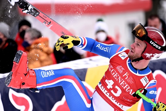 epa09699713 Blaise Giezendanner of France reacts in the finish area during the men&#039;s Downhill race of the FIS Alpine Skiing World Cup event in Kitzbuehel, Austria, 21 January 2022. EPA/CHRISTIAN  ...