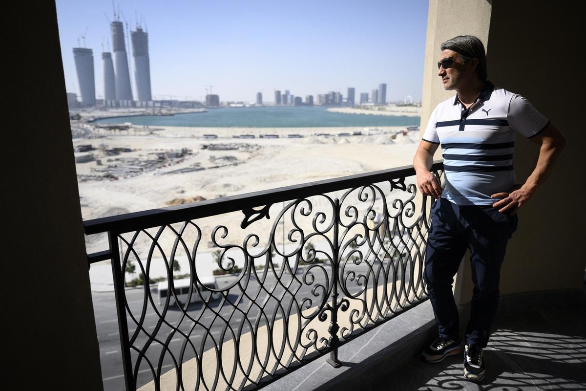 Switzerland's soccer national team head coach Murat Yakin looking at the view from a room of the hotel "Le Royal Meridien" during his visit of the hotel as they choose the Switzerland t ...