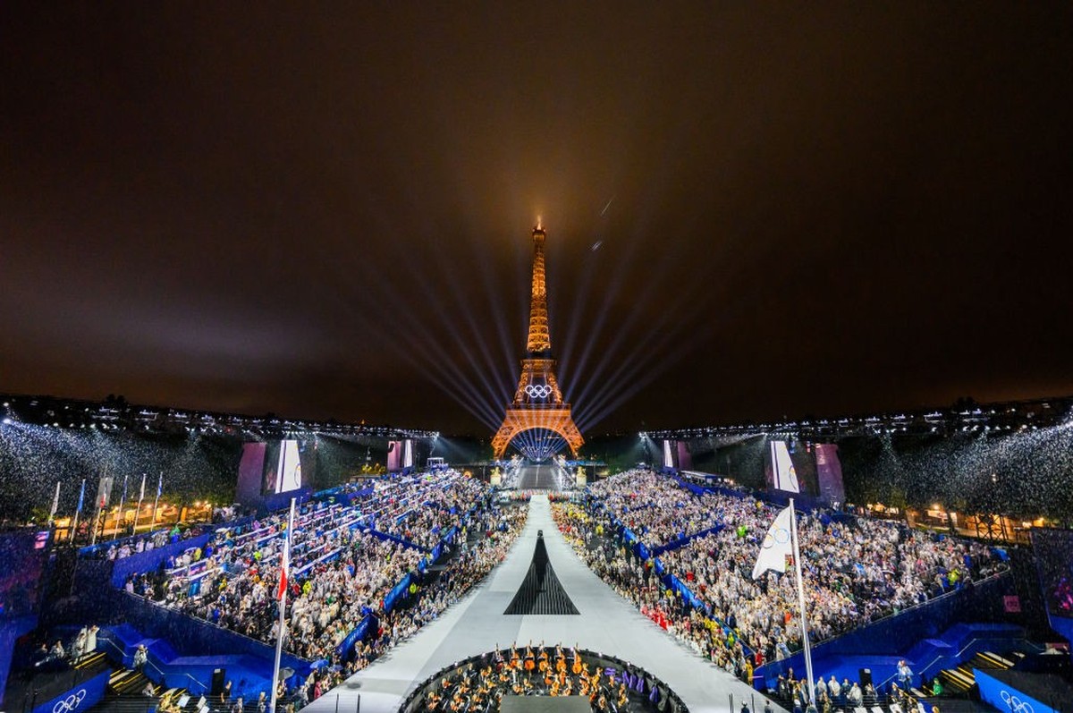 PARIS, FRANCE - JULY 26: The Olympic Flag is raised at Place du Trocadero during the opening ceremony of the Olympic Games Paris 2024 on July 26, 2024 in Paris, France. (Photo by Lintao Zhang/Getty Im ...