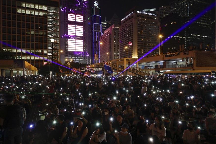 Protesters fresh their smartphone&#039;s lights to give support the prayer rally at Edinburgh Place in Hong Kong, Saturday, Oct. 19, 2019. Hong Kong pro-democracy protesters are set for another weeken ...