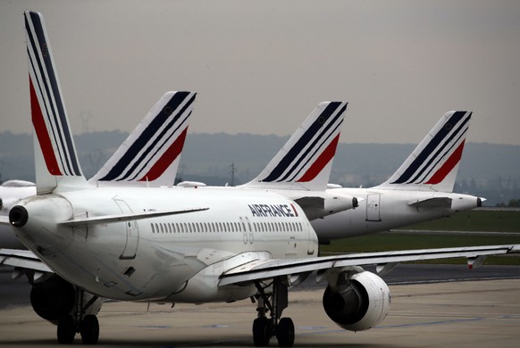 FILE - In this May 17, 2019 file photo, Air France planes are parked on the tarmac at Paris Charles de Gaulle airport, in Roissy, near Paris. Air France announced Thursday Jan.30, 2020 it is suspendin ...