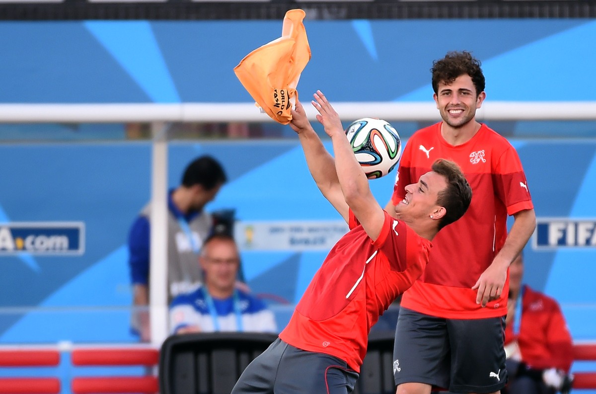Switzerland's midfielder Xherdan Shaqiri and Switzerland's forward Admir Mehmedi (L) take part in an official training session at The Corinthians Arena Stadium in Sao Paulo on June 30, 2014, ...