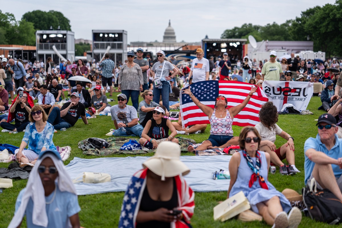 People sit on the National Mall at Rededicate 250, a mostly conservative Christian prayer gathering in honor of the United States' 250th anniversary, Sunday, May 17, 2026, in Washington. (AP Phot ...