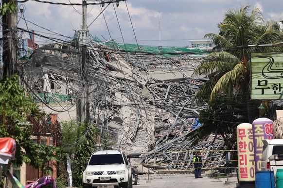 Caution tape marks the area around a collapsed building in Angeles city in Pampanga province, north of Manila, Philippines, Sunday May 24, 2026. (AP Photo)
Philippines Building Collapse