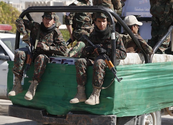 epa09677722 Houthi fighters riding a truck patrol during a mass funeral of 29 slain Houthi fighters who were killed in recent fighting against Saudi-backed government forces, in Sana&#039;a, Yemen, 10 ...