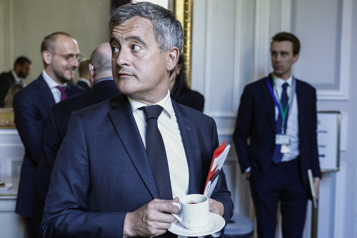 epa12902479 France's Justice Minister Gerald Darmanin reacts while holding a cup during the 6th Ministerial Meeting of the European Coalition Against Organized Crime at the Hotel de Beauvau, the  ...