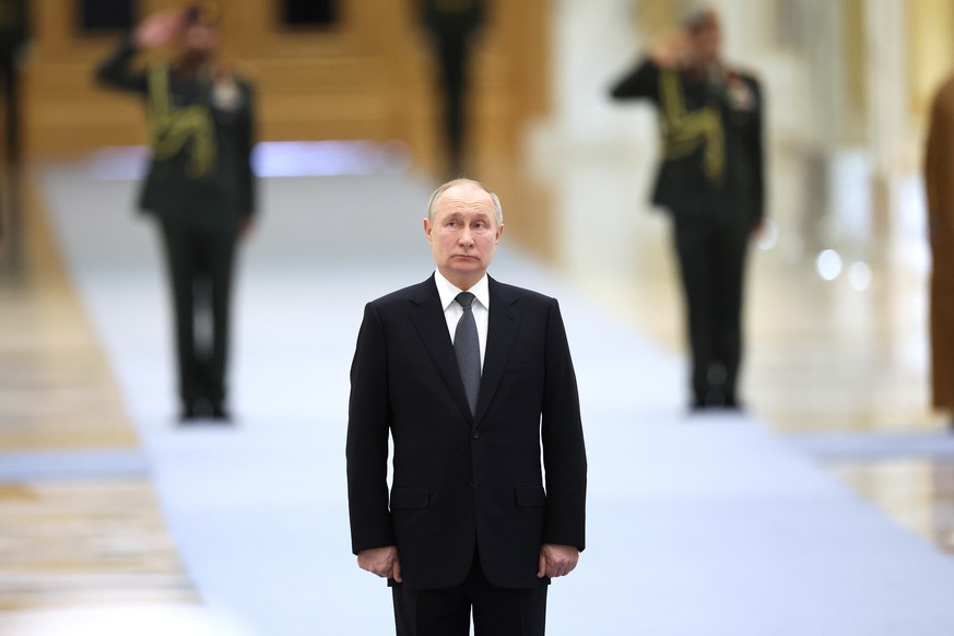 epa11013747 Russian President Vladimir Putin attends a welcoming ceremony before a meeting with President of the United Arab Emirates Sheikh Mohamed bin Zayed Al Nahyan at Qasr Al Watan Palace in Abu  ...